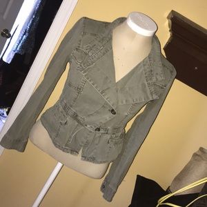a jean jacket with buttons up and long sleeves.